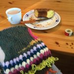 knitting work-in-progress with tea and cake